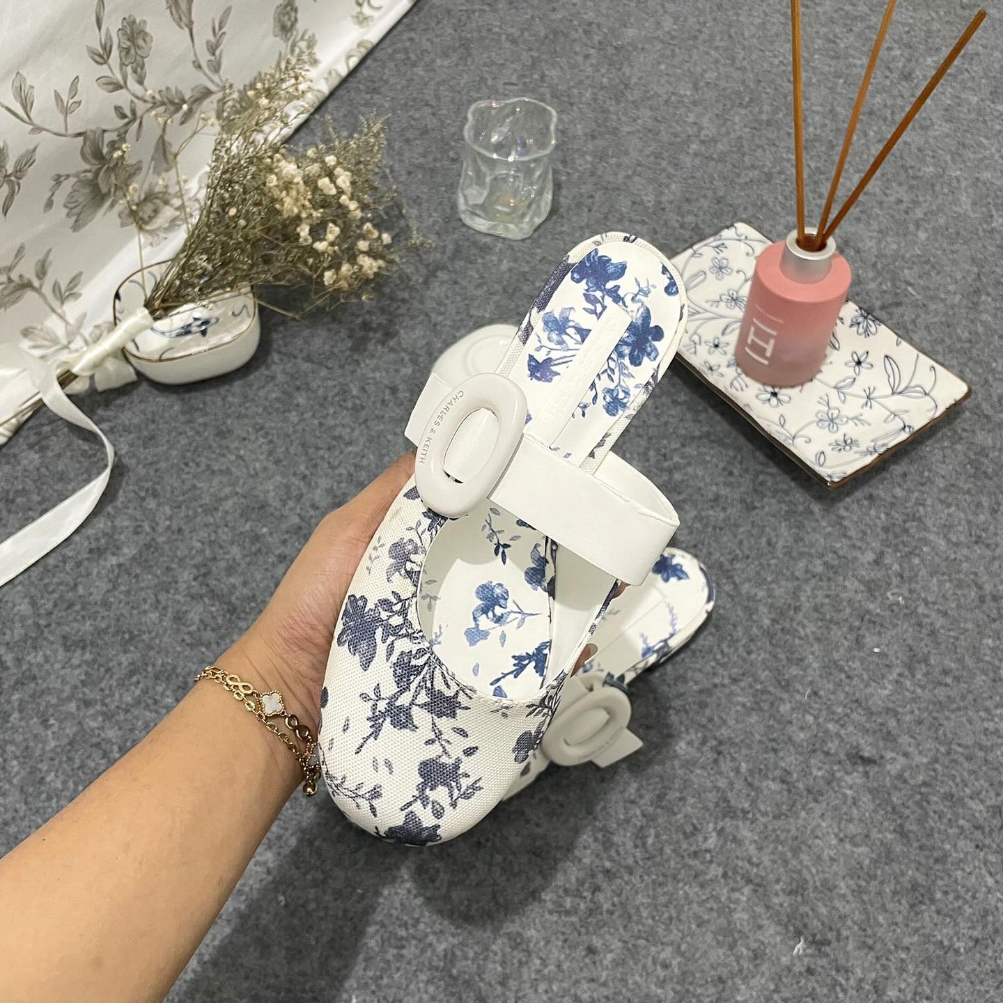 Premium floral-print mules Material Linen with oval-buckle straps complement