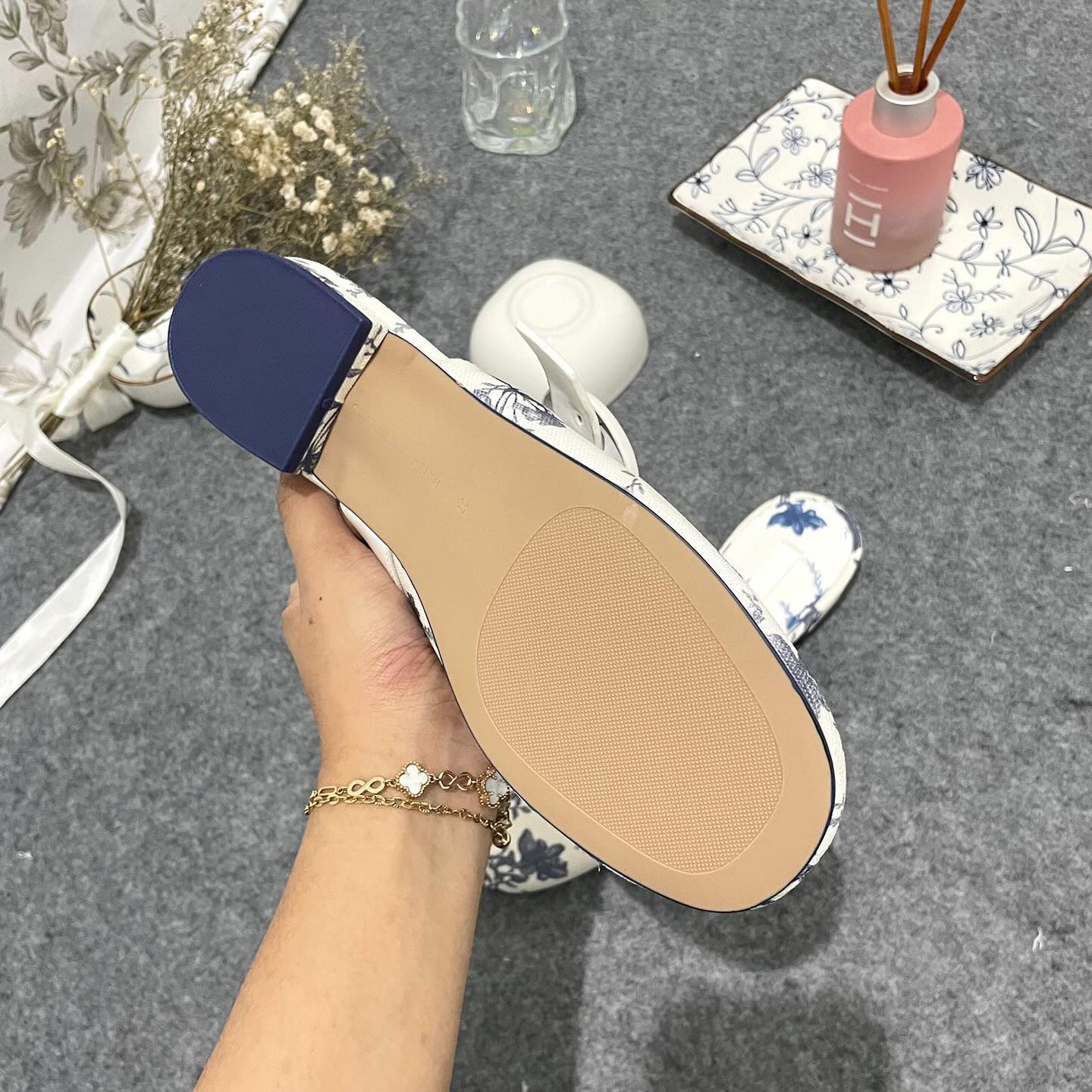 Premium floral-print mules Material Linen with oval-buckle straps complement